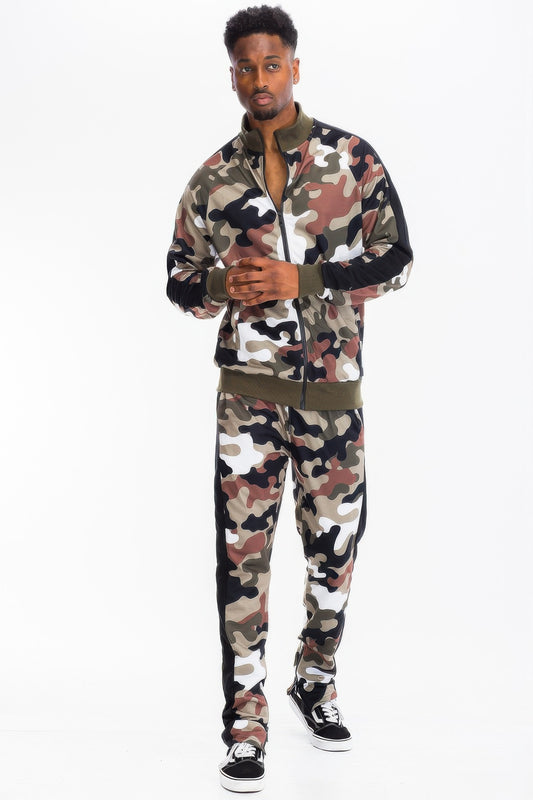 Full-length front view of a model wearing Stylia's full camouflage print track pants with high-contrast athletic side stripes in the US.